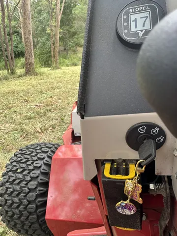 Ventrac slope meter displaying 17 degrees on a wooded slope, Pullenvale
